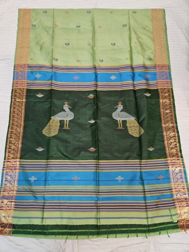 Pastel Cream Pure Bishnupur Katan Silk Kalakshetra Saree with Dark Green Peacock Motif Pallu