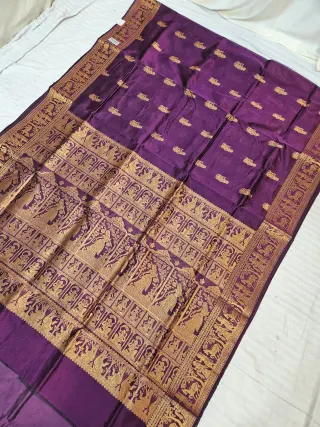 Purple and Golden Zari Woven Royal Narrative Swarnachari Soft Silk Saree