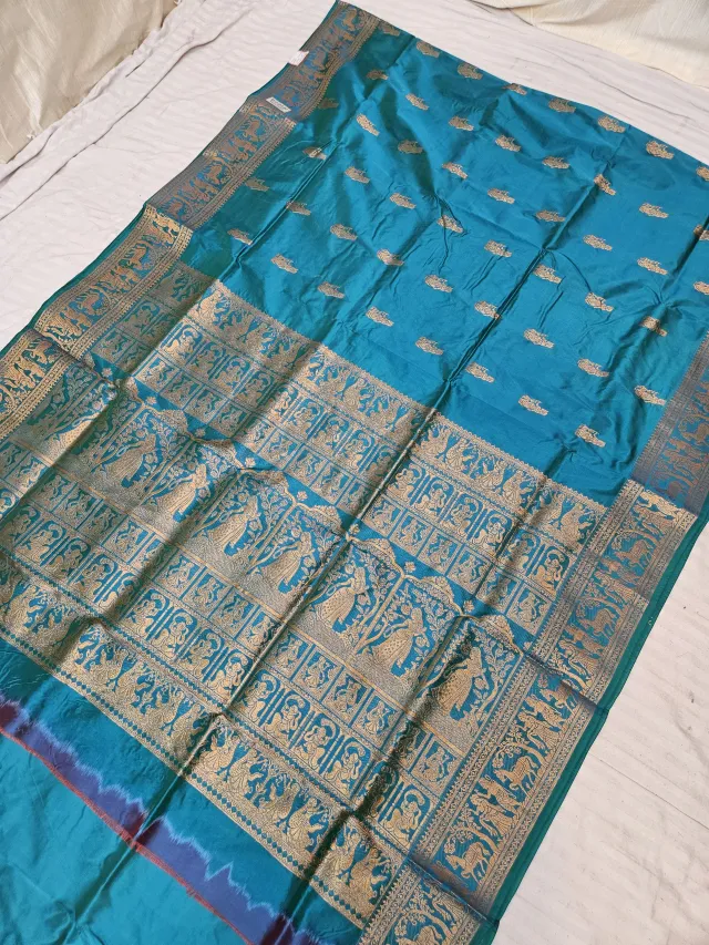 Firoza Blue and Golden Zari Woven Royal Narrative Swarnachari Soft Silk Saree