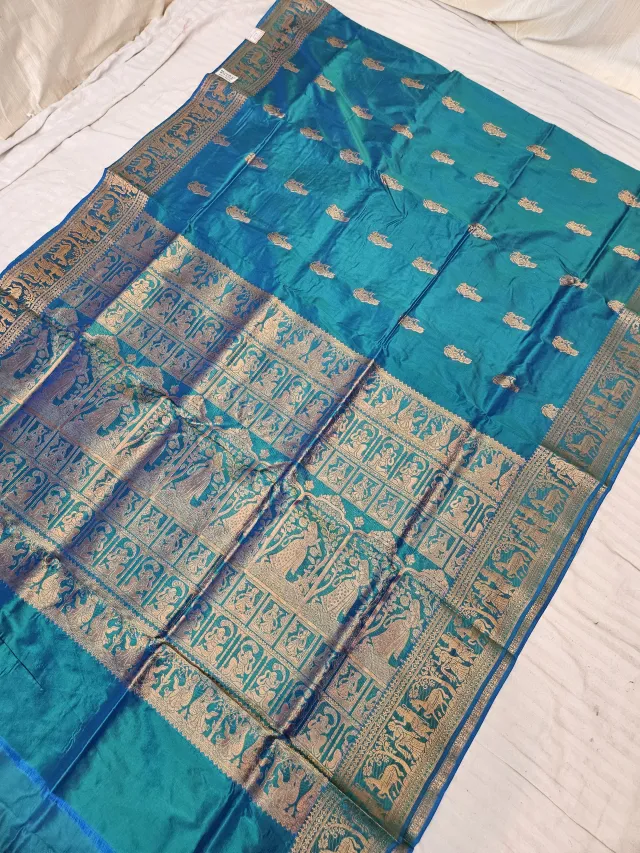 Mayurkanthi Peacock Blue Green and Golden Zari Woven Royal Narrative Swarnachari Soft Silk Saree