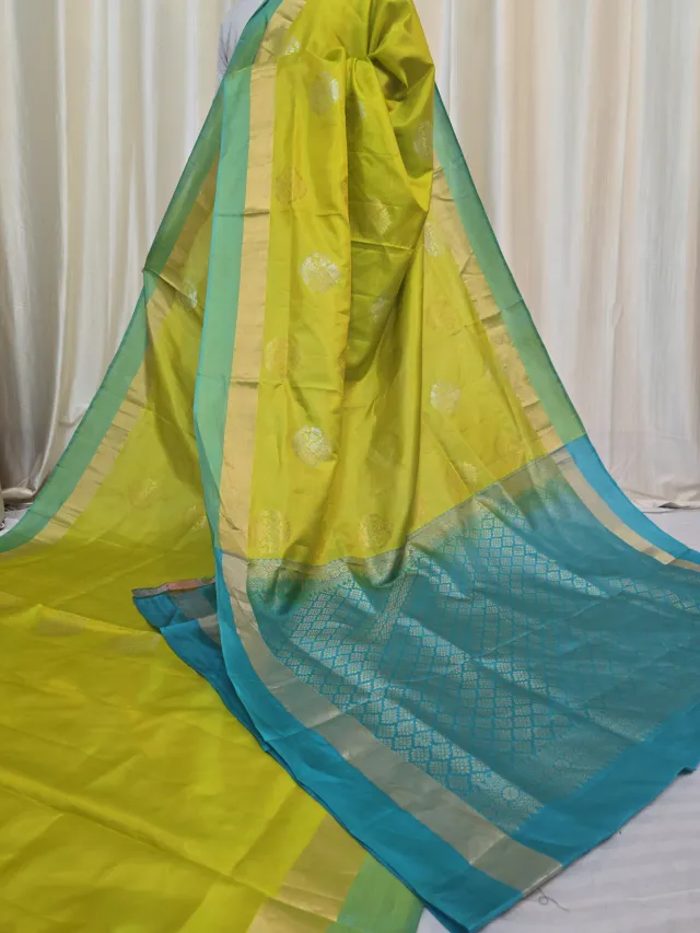 Lemon Yellow Arani South Silk Saree with Coin Buta & Contrast Turquoise Blue Zari Pallu