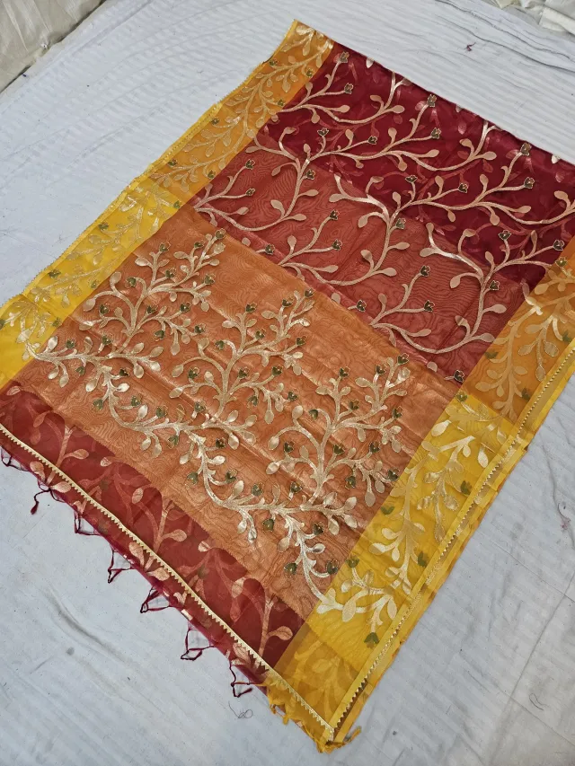 Crimson Maroon and Sunset Orange Muslin Jamdani Soft Silk Saree with All-Over Floral Jaal and Yellow Border