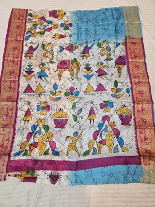 Sky Blue and Off-White Pure Bangalore Silk Saree with Woven Baluchari Border and Handcrafted Warli Folk Art Batik Handprint
