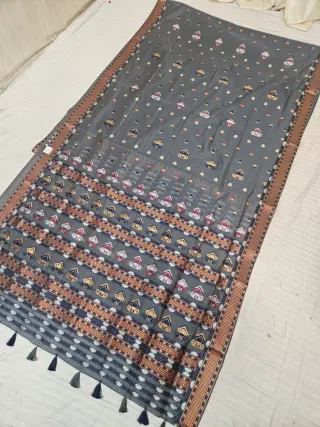 Slate Grey Assam Tussar Soft Silk Saree with Traditional Woven Assamese Tribal Motifs and Tasselled Pallu