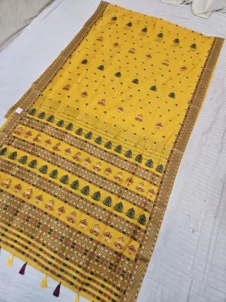 Mustard Yellow Assam Tussar Soft Silk Saree with Traditional Woven Assamese Tribal Motifs and Tasselled Pallu