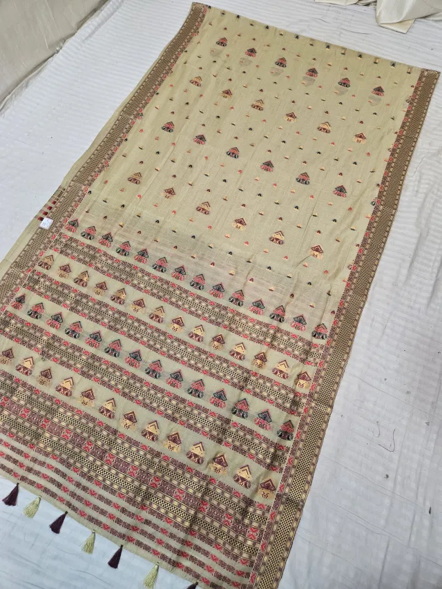 Natural Beige Assam Tussar Soft Silk Saree with Traditional Woven Assamese Tribal Motifs and Tasselled Pallu