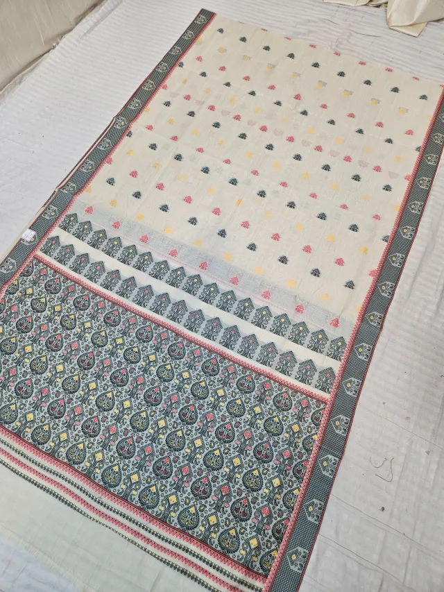 Cream and Teal Green Assam Tussar Soft Silk Saree with Traditional Woven Tribal Motifs and Rich Ornamental Pallu