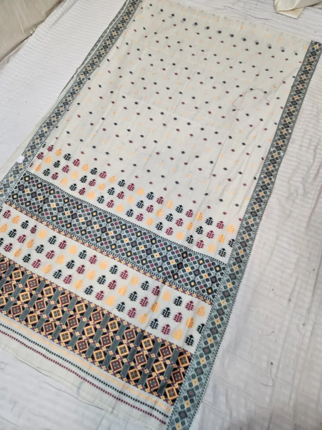 Cream and Slate Grey Assam Tussar Soft Silk Saree with Traditional Woven Tribal Geometric Motifs and Lattice Pallu