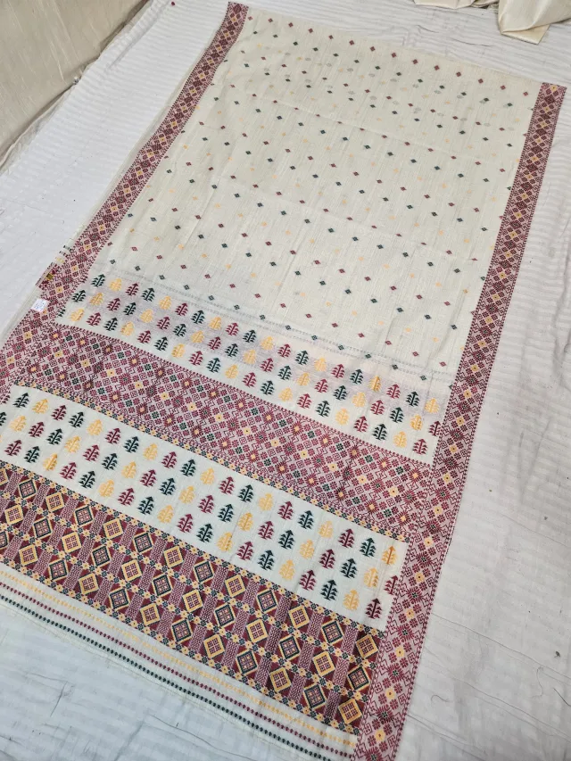 Cream and Maroon Assam Tussar Soft Silk Saree with Traditional Woven Tribal Geometric Motifs and Lattice Pallu
