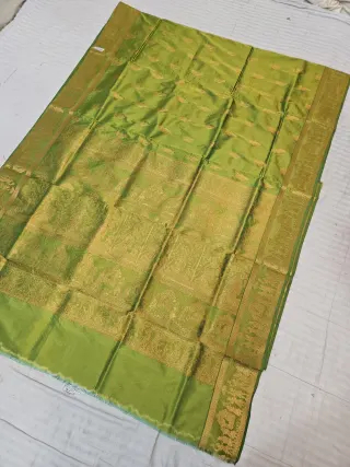 Parrot Green Self Zari Swarnachari Soft Silk Saree with Mythological Narrative Pallu