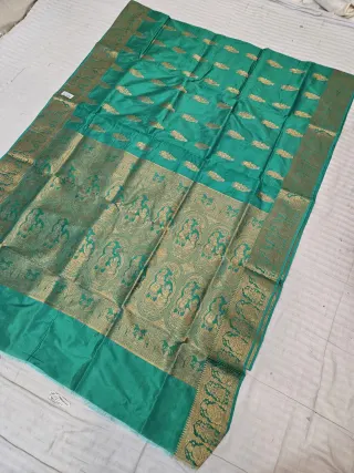 Emerald Green Self Zari Swarnachari Soft Silk Saree with Mythological Narrative Pallu