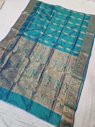 Peacock Blue Self Zari Swarnachari Soft Silk Saree with Mythological Narrative Pallu