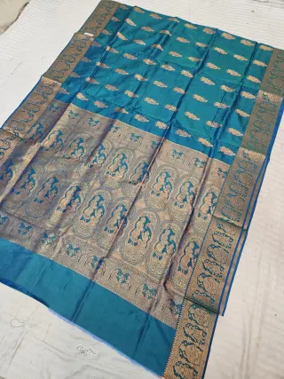 Deep Teal Blue Self Zari Swarnachari Soft Silk Saree with Mythological Narrative Pallu