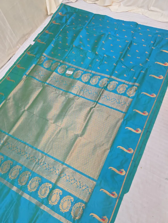 Cyan Blue Soft Silk Irkal Self Saree with Woven Gold Zari Lattice Brocade Pallu & Peacock Border