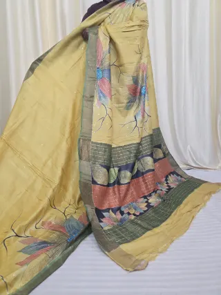 Golden yellow body with multi-coloured Petai work floral blossoms and multi-tiered striped lotus pallu