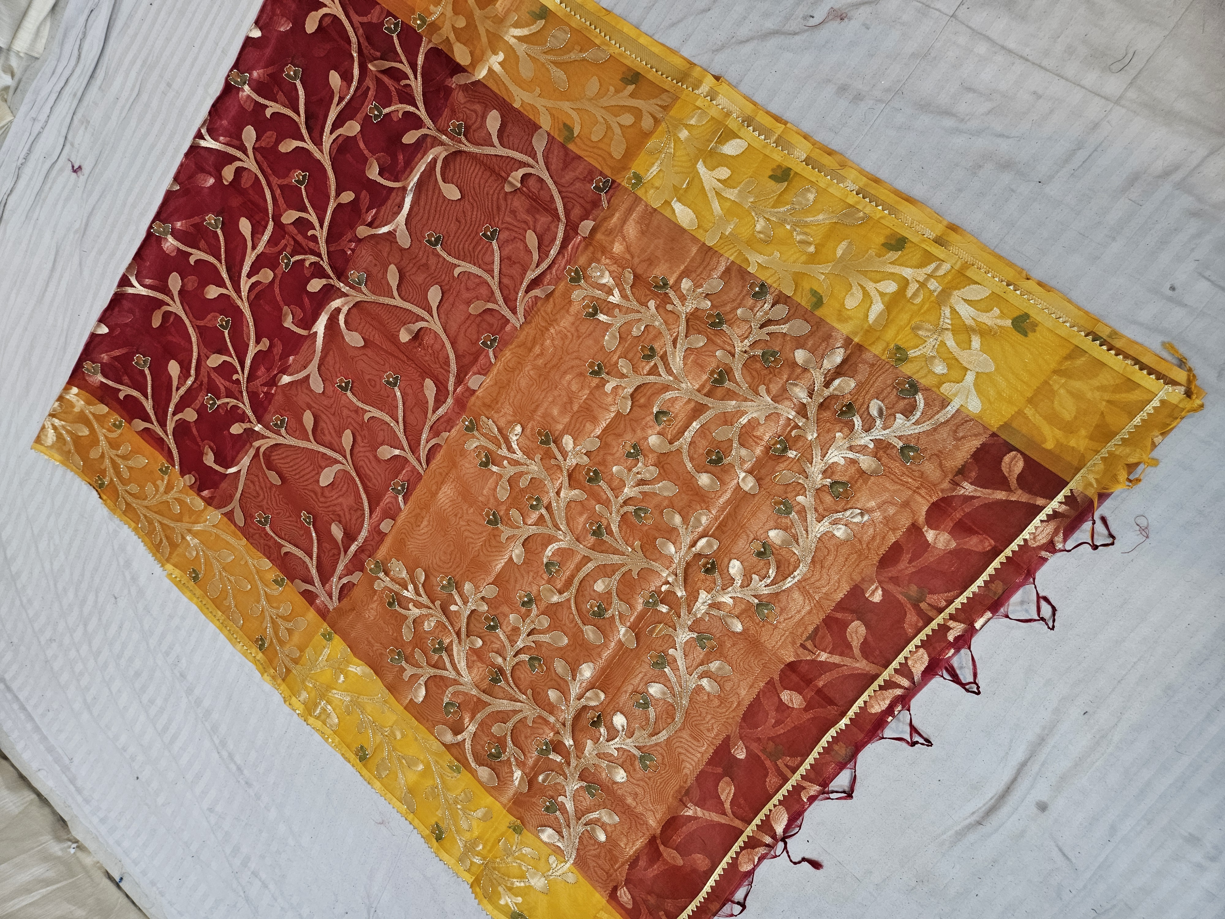 Crimson Maroon and Sunset Orange Muslin Jamdani Soft Silk Saree with All-Over Floral Jaal and Yellow Border